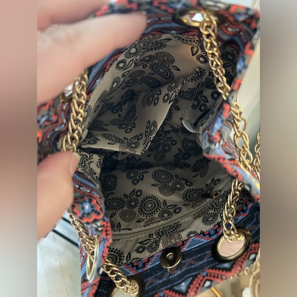 Multi pattern cinch purse. Never used, new with tags. Gold chain strap. - Picture 2 of 3
